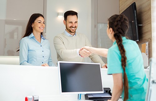 Couple meeting a receptionist