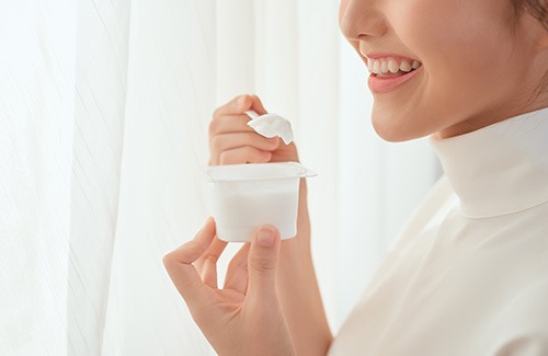 woman eating yogurt 