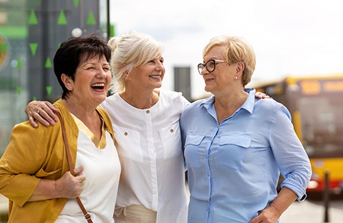 Group of friends smiling together outside