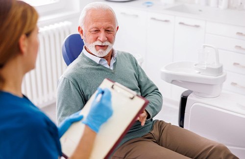 a man during his dental implant consultation