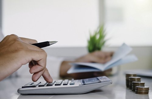 Man using a calculator