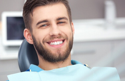 man smiling during dental checkup