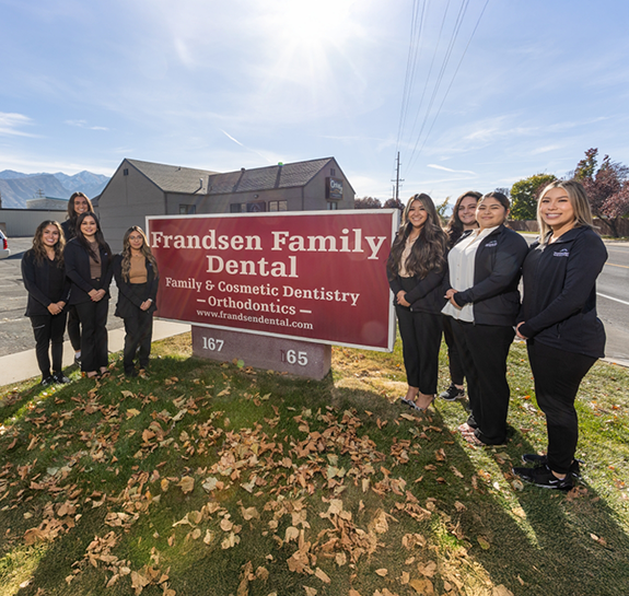 Smiling dentists and team at Frandsen Dental of Orem