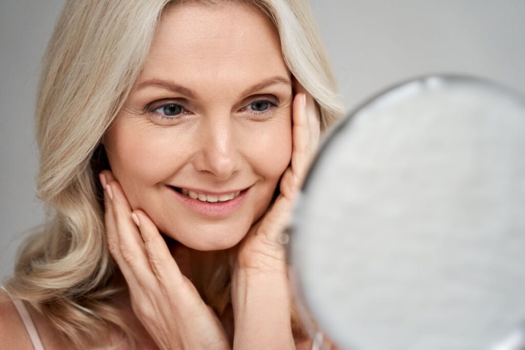 A woman smiling in a mirror